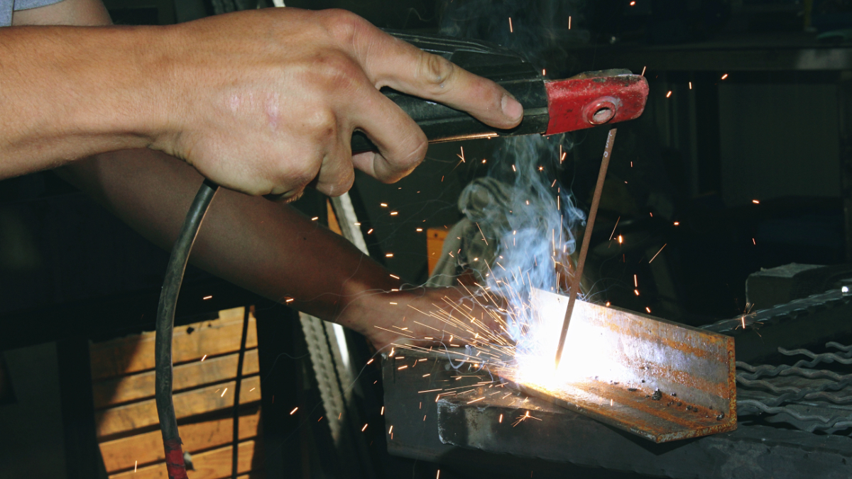 Man welding busbar Manufacturing